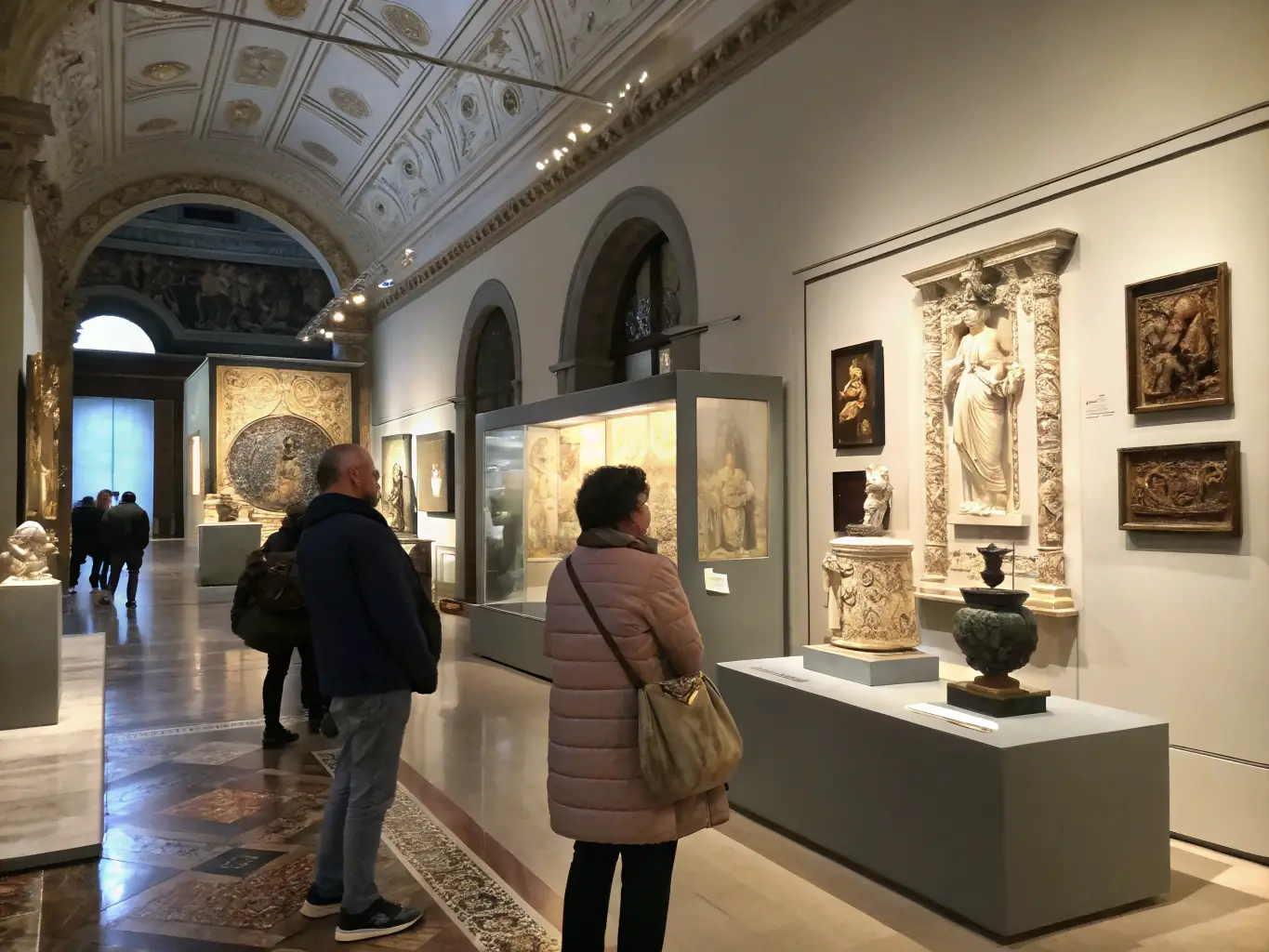 A vibrant exhibition space displaying intricate embroidery pieces with visitors engaging with the artworks, highlighting the cultural exhibitions organized by LA GRANDE BRODEE.